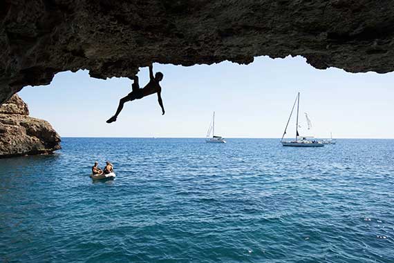 Deep water solo in Majorca. Climb and sail in Spain